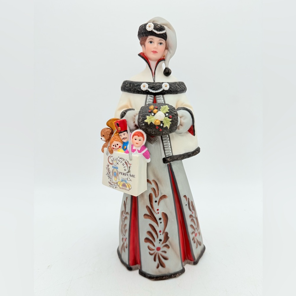 Avon 1999 MRS ALBEE President's Club Award Porcelain Figurine - Lady with toys -